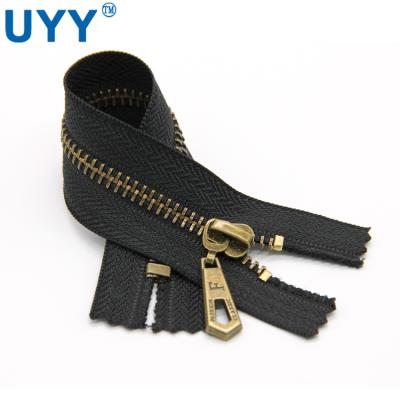 China UYY 18 Cm 5# Metal End Sustainable End Gold Brass Zippers For Luggage Bags for sale