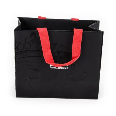 China Good Quality Recyclable Xindonsen UV Printed Black Garment Gift Packaging Paper Bag Custom Logo Shopping Bag With Cotton Handle for sale