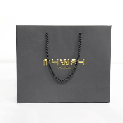 China Xindonsen Recyclable Custom Design Eyewear Smart Watch Packing Paper Bags Gold Foil Stamping Gift Package Black Paper Bags for sale