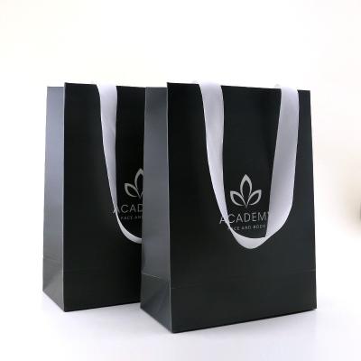 China Recyclable Xindonsen Paper Bag Custom Black Logo Luxury Cloth Packing Matt Printing Shopping Bag With Ribbon Handle for sale