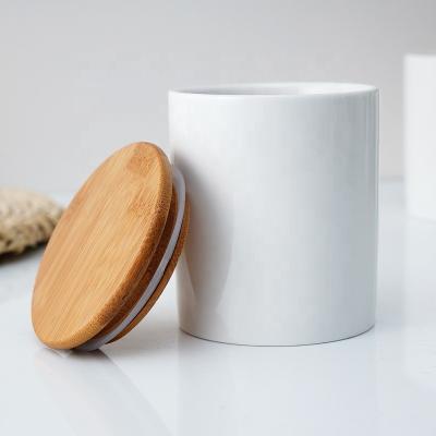 China Amazon Hot Sale Viable Bone China Storage Bottles And Jar Ceramic Kitchen Storage Spice Tea Nut Container With Lid And Bamboo Spoon for sale