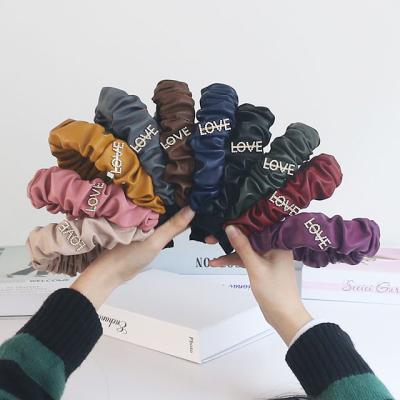 China Daily crumpled leather fluffy headband LOVE logo headband fairy hair accessories women for sale