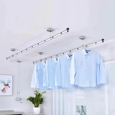 China Space Saving Manual Ceiling Mounted Clothing Rack Display Clothing Store Racks for sale