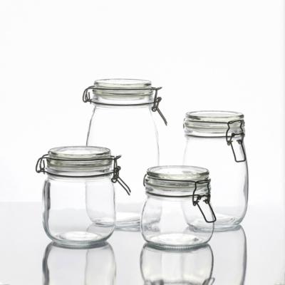 China Freshness Preservation Factory Custom Spherical Clasp Storage Jar Glass Sealed Jar Around Square Food Canned Honey Jar for sale