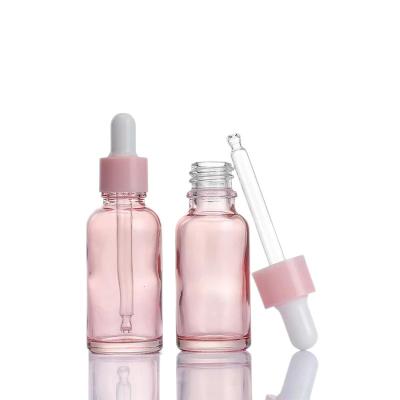 China Cosmetic 10ml 15ml 20ml 30ml Dropper Bottles Containers Essential Oil Pink Glass Bottle for sale