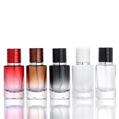 China Hot Selling 30ml 50ml Cosmetic Empty Progressive Dark Blue Shaped Cosmetics Spray Glass Perfume Bottle for sale