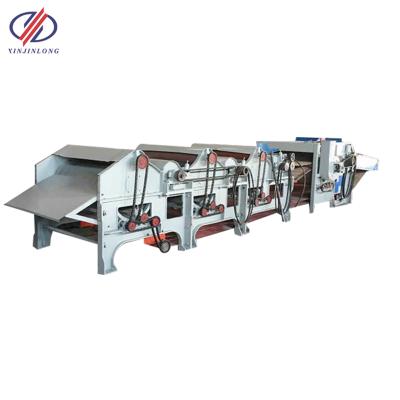 China Textile Xinjinlong Fabric Waste Four Roll Recycling Machine Textile Recycling Machine for sale