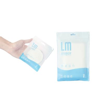 China Disposable Small Bag Packed Biodegradable Nonwoven Magic Compressed Coin Towel for sale