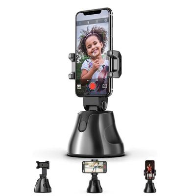 China Bluetooth Christmas Auto Tracking 360 Gifts Rotate Mobile Phone Holder Smart Selfie Robot Live Stream Smart Shooting Camera Phone Mount for sale