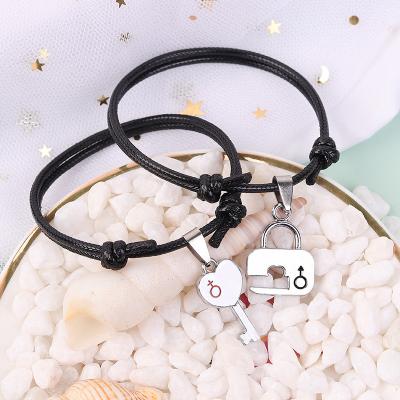 China Fast Delivery 2pcs/set Unique Design Handmade Black Wax Rope Couple Bracelets Adjustable Heart Lock And Key Connecting Bracelet for sale