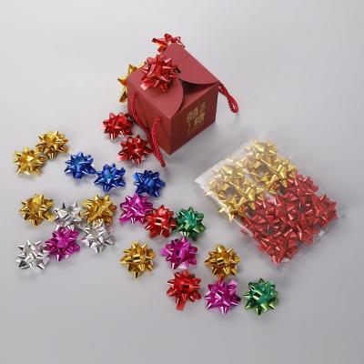 China Iridescent rugby ball D  Gift Wrapping PP Star Bow Metallic Plastic Ribbon Star Bow for Gift Wrap for sale