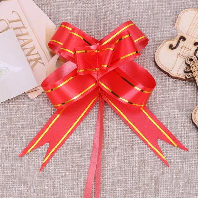 China Iridescent rugby ball Wedding Festival Celebration Phnom Penh Hand Pull Flower Wedding Car Mirror Decoration Gift Candy Box Packaging Pull Flower bow for sale