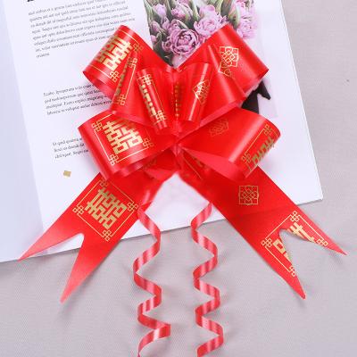 China Iridescent rugby ball Wedding festive hand-drawn flower wedding wedding car decoration happy word pull flower classical red flower bow for sale