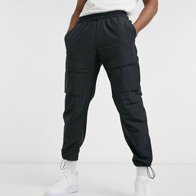 China QYOURECLO Custom Anti-wrinkle Cargo Jogger Logo Sport Trousers Mens Nylon Anorak Track Cargo Pants for sale