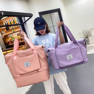 China New Large Capacity Folding Multifunctional Travel Bags Tote Handbag Travel Duffle Bags Waterproof Women Multifunctional Travel Bags for sale