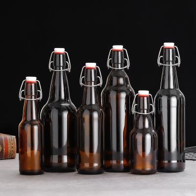 China Beverage Swing Top Flip Top Easy Glass Bottle For Wine Juice Beverage Liquor Amber Beer Bottles With Buckle for sale