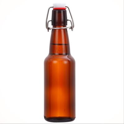 China Beverage Amber Liquor Beer Bottles With Loop Swing Top Flip Top Easy Glass Bottle For Wine Juice Beverage for sale