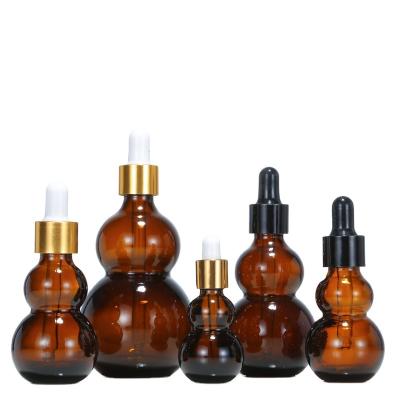 China Antique Fancy 10ml/15ml/50ml Cosmetic Amber Gourd Essential Oil Bottles Glass Dropper Bottle for sale