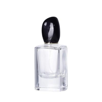 China 30ml 50ml 100ml Cosmetic Rectangle Shaped Luxury Empty Glass Perfume Bottles With Black Cap for sale