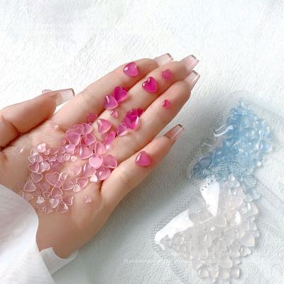 China Nail Art Decoration 100pcs/bag Heart Mounted Bow Flower Stones Bulk Color Change In UV Light Nail Art Rhinestone Crystal Charm For Nails for sale