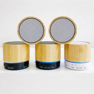 China Colorful LED Light A10 Led Mini Blue Tooth Speaker Bass Light Radio Stereo Wood Tooth Speakers for sale