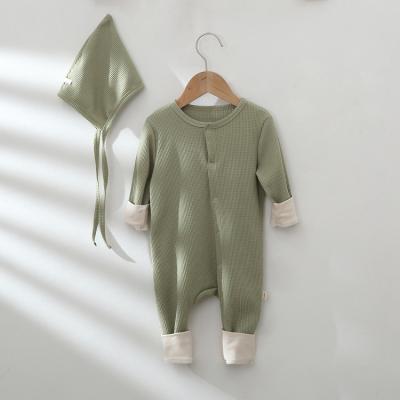 China Comfotable Baby Knitted Romper Waffle Jumpsuit With Hat Sleeves Solid Newborn Long Jumpsuit for sale