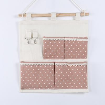 China Puting hanging storage bag pockets organizer door wall chest holder customized red green dot for sale