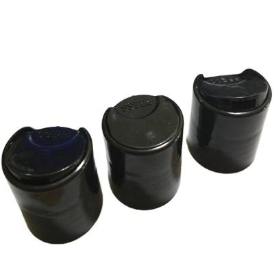 China Screw Cap / Disc Cap / Flip Top Cap 20 24 28 PP Plastic Solid Black Plastic Disc Press Top Caps For Cosmetic Bottle for sale