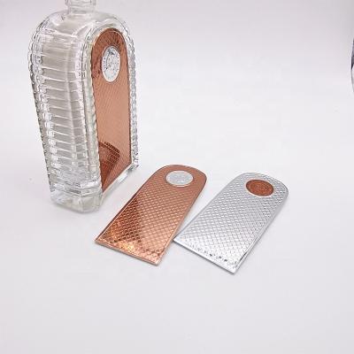 China Custom embossed 3d embossed waterproof metal sticker slim metal perfume bottle label sticker for sale