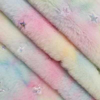 China Rainbow Shrink-Resistant Gradient Dye Laser Film Bronzing Star Cushion Tile Toy Rabbit Velvet Polyester Fabric for sale