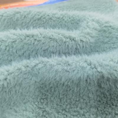 China Breathable polyest pattern polyester knit flannel plush microfiber grain fleece hometextile fabric for sale