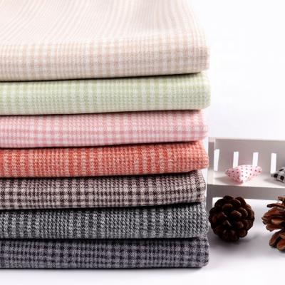 China New Style Yarn-dyed Quality Assurance Quality Control Anti-Static Knitting Brushed Fleece Fabric For Winter Coat for sale