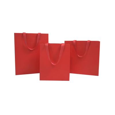 China Custom Made Recycled Materials Clothing Shopping Bag Gift Paper Bag Packaging With Handle Luxury Bags For Wedding / Jewelry / Cosmetic for sale