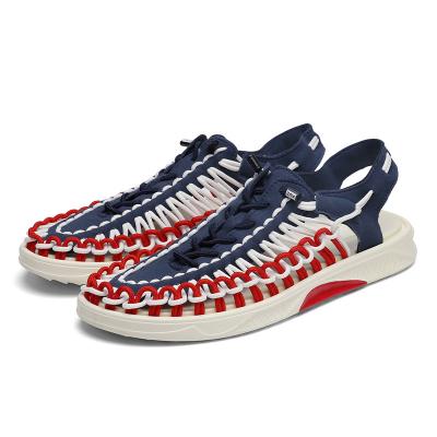 China Flat 2022 Summer Trend Men's Non-slip Casual Shoes Woven Beach Water Breathable Hollow Shoes Outdoor Flat Sandals for Men for sale