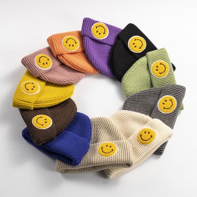 China COMMON Custom Logo Winter Candy Color Lightweight Smiley Warm Acrylic Knitted Beanie Hat Adult Smiley Face Beanies for sale