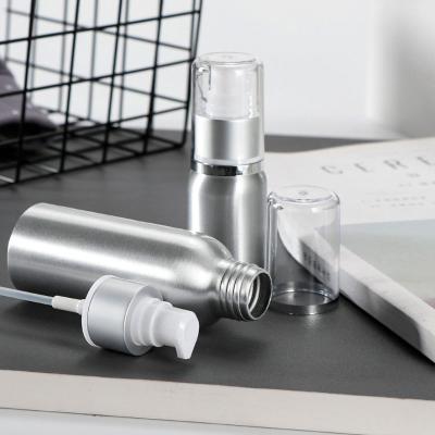 China 30ml 50ml 100ml Cosmetic Silver Spray Bottle Empty Plastic Aluminum Cream Pump for sale