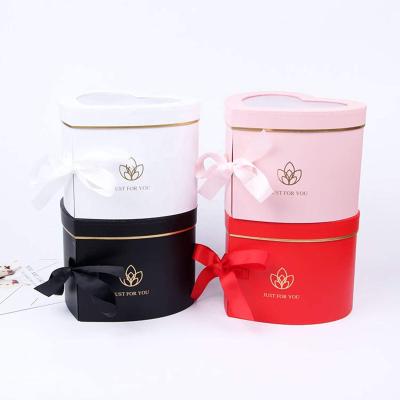 China Wholesale Recyclable Luxury Flower Box With Heart Shaped Logo And Clear Window Gold Foiling Ribbon Rose Flower Boxes Assorted Colors for sale