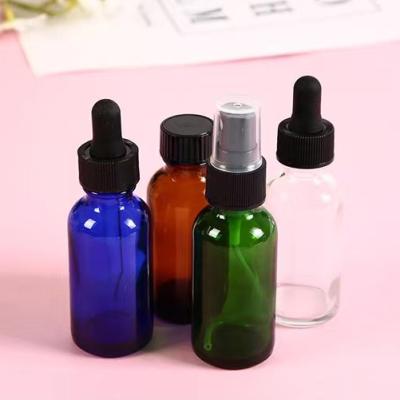 China Cosmetic Plastic Dropper Cap Round Essential Oil Bottles Bulk Amber Blue Green 1oz Dropper Bottle With Lids For Essential Oils Scents for sale