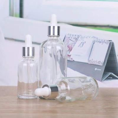 China Eco Friendly Skin Care Cosmetic Packaging Round Silver Cap 5-100ml Glass Dropper Bottles For Aroma Gift Essential Oil Serum Liquid for sale