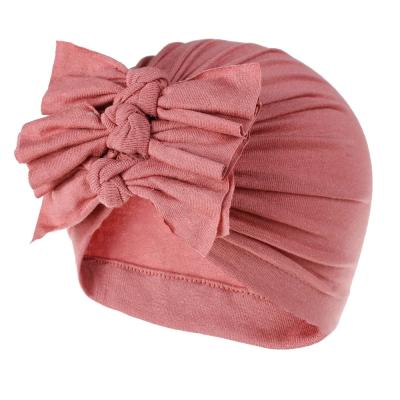 China Comfortable children's hats hoods spring and summer new soft knitted cloth fold bow baby hats turban for sale