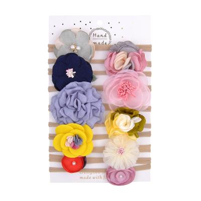 China Cozy Children's Bowknot Headband 10 1 Bundle Cards Infant Baby Headband Nylon Flower Headdress for sale