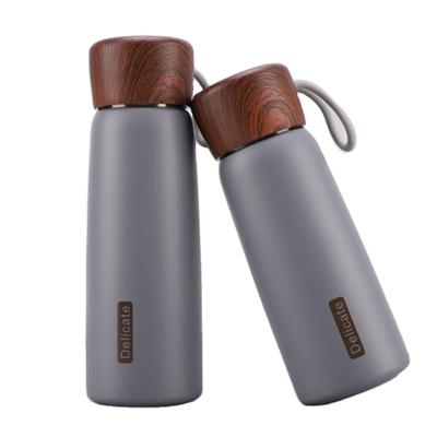 China PORTABLE Wholesale 400ml/500ml Stainless Steel Water Bottles Insulated Water Bottle With Wood Grain Lid for sale