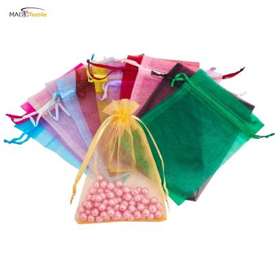 China Mini Silk Drawstring Organza Mesh Eco-friendly Pink Wedding Pouch Organza Gift Packaging Cosmetic Bags With Tassels for sale