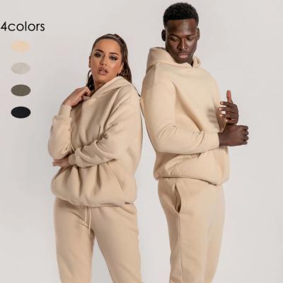 China New Breathable Casual Sportswear 2 Piece Hooded Loose Long Sleeve Men Tracksuits Pants Sport Tracksuit for sale