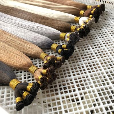 China Wholesale Silky Straight Virgin Hair Double Wave Weft Hand Drawn Double Tied Weft Extension for sale