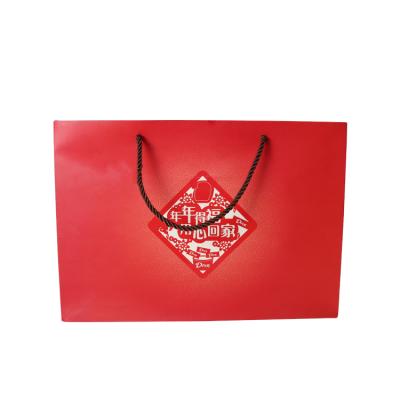 China Handmade Customized Red Shopping Kraft Paper Wine Bag With Gold Stamping Logo for sale