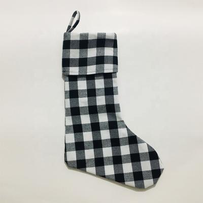 China Eco-Friendly and Reusable Check Large Plaid Decor Black White Stockings Merry Christmas Christmas Stockings Hanging Gift Stockings for Xmas Holiday Decor for sale