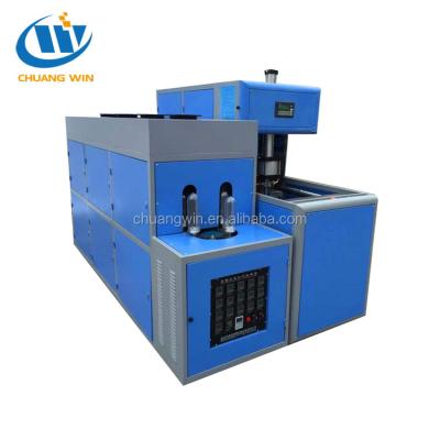 China Semi-automatic Bottle PET Bottle Blow Molding Machine For Hot Filling Juice Bottle for sale