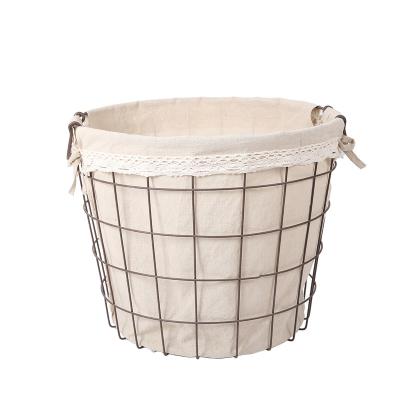 China New Sustainable Round Hollow Out Home Wrought Iron Canvas Storage Basket Wire Mesh Storage Baskets Iron Basket With Cloth for sale