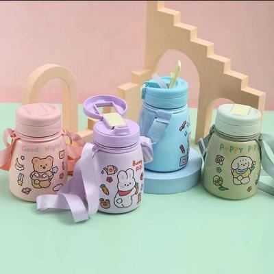 China Newest Stainless Steel Vacuum Stocked Water Bottle For Kids Cartoon Printing 2 Ways Drinking Lid With Strap for sale